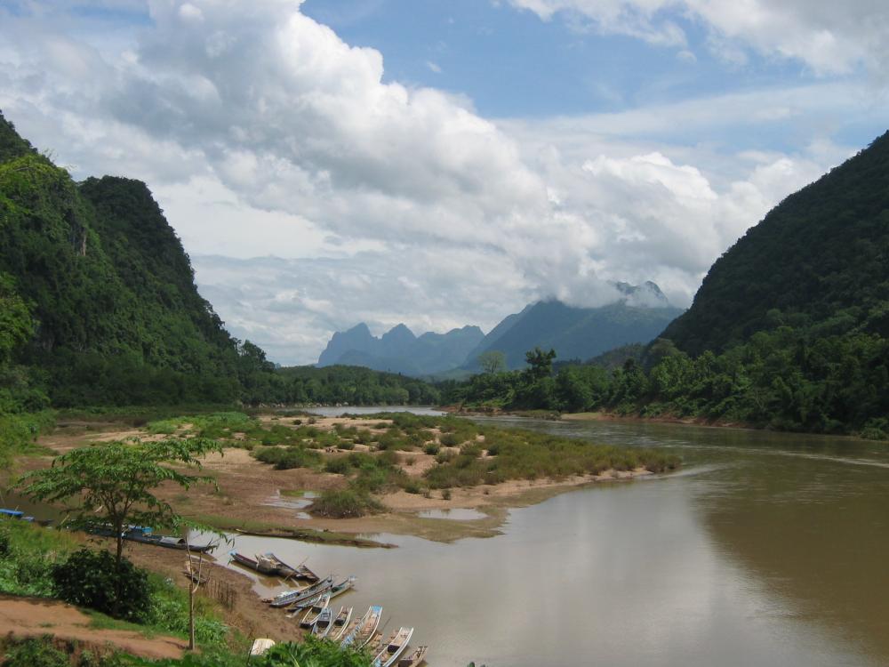 Muang Ngoi in a karst landscape covered by a deep jungle