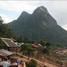 Sitting in a restaurant in Muang Ngoi, in front of the holly mountain named "young girl" for its languorous shape